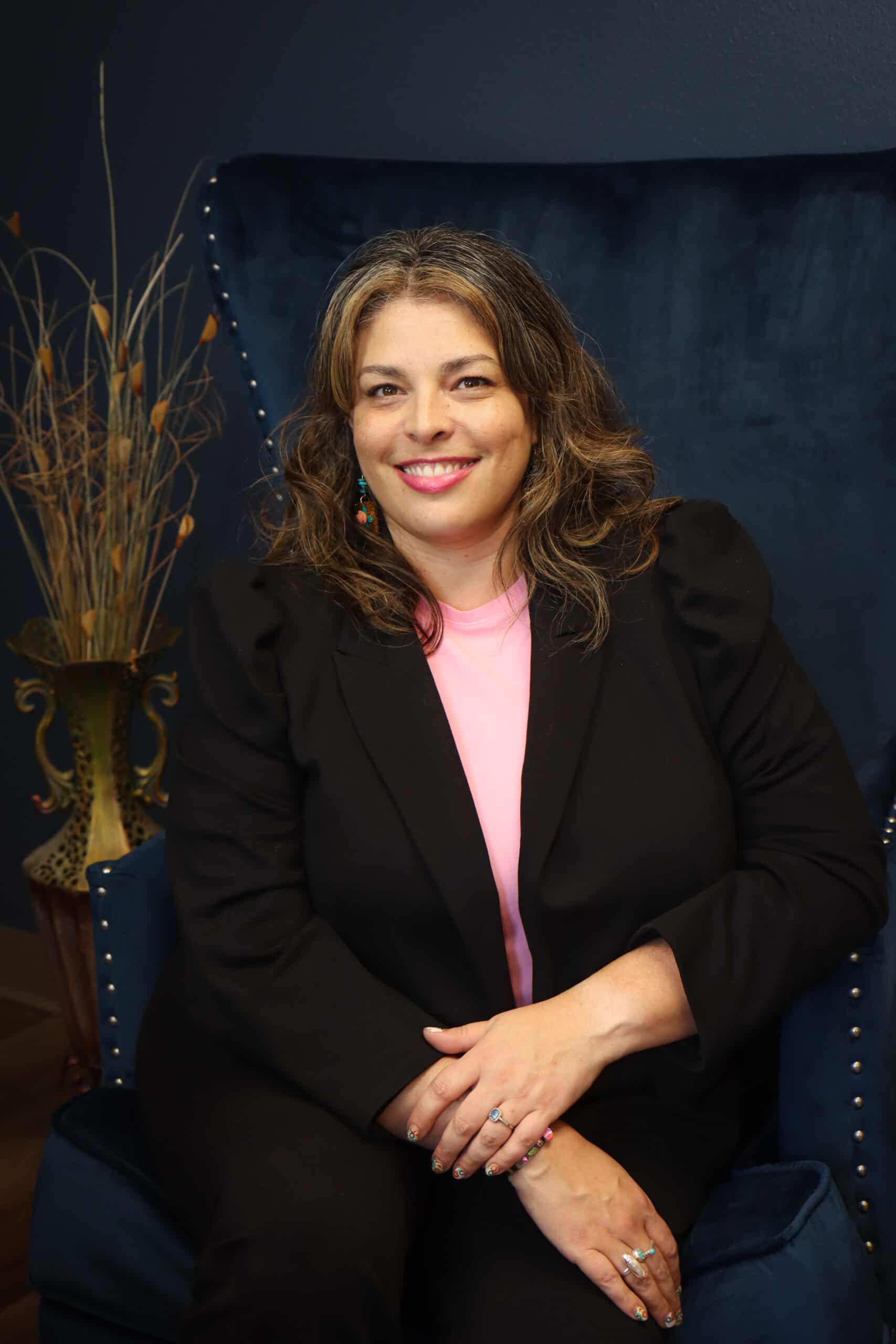 woman sitting in chair smiling